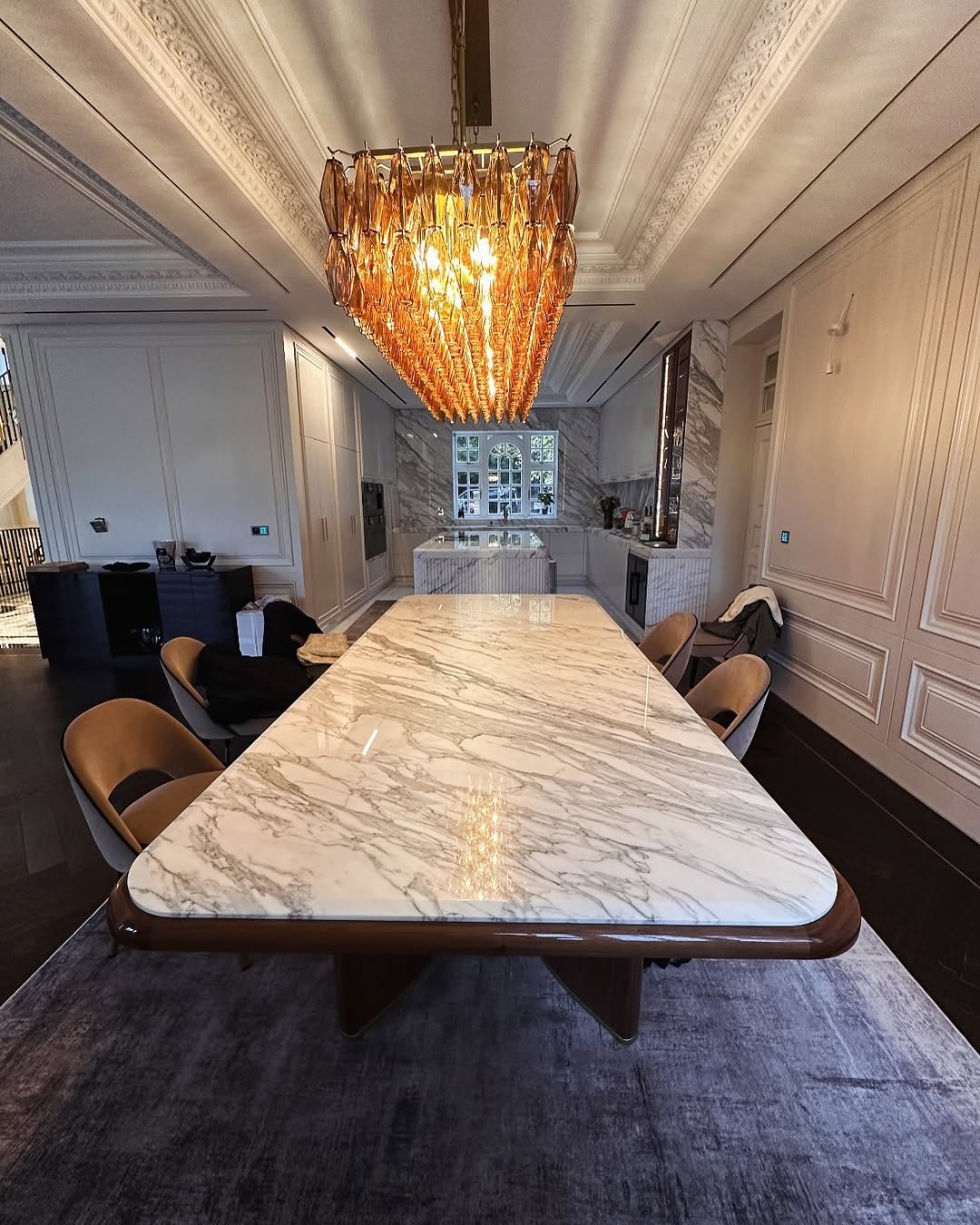 Close-up of Calacatta Marble dining table top showing natural grey and gold veins